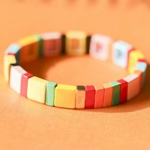 Not Just Another Rainbow Brite: Rainbow and gold tone stretch enamel bracelet.